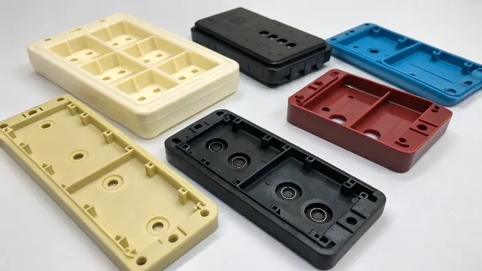 Side-by-side comparison of plastic parts showing color variation vs. consistent color