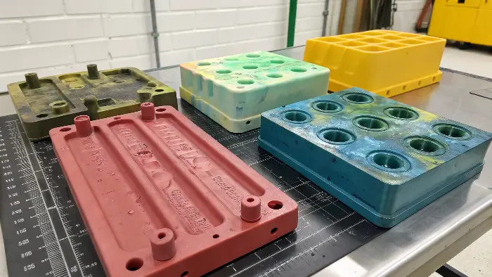 Injection molded parts showing streaks and swirls of color