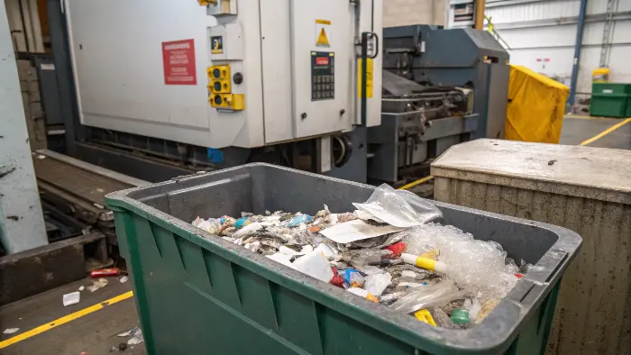 An image showing a plastic part still attached to its runner and sprue