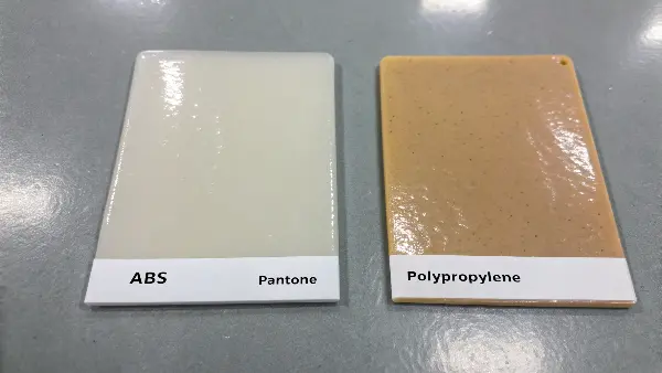 Side-by-side comparison of the same blue color on a glossy ABS plastic and a matte PP plastic