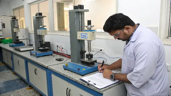 engineers analyzing PVC properties on a computer